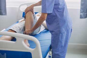 physiotherapist working with patient clinic closeup 265022 24210